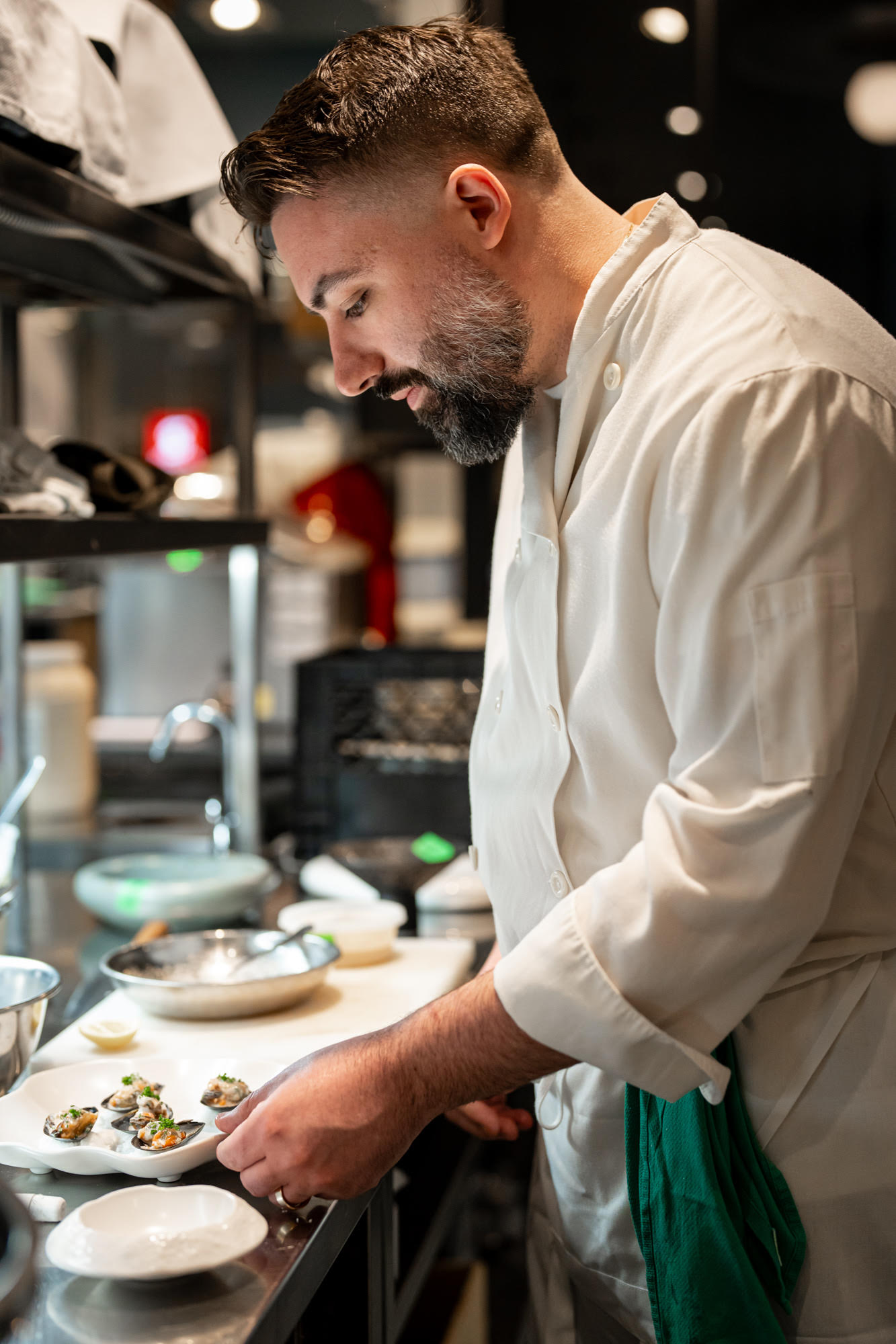 Chef Michael Angeloni plating in the kitchen at Restaurant Lucie