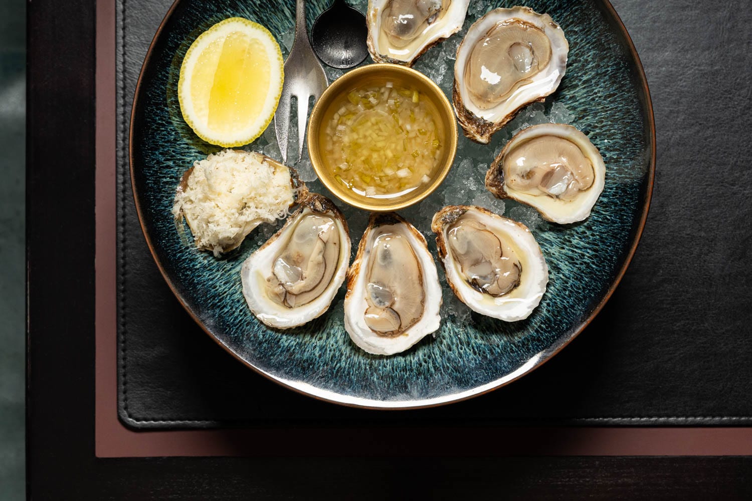 Oyster platter on ice with mignonette at Restaurant Lucie