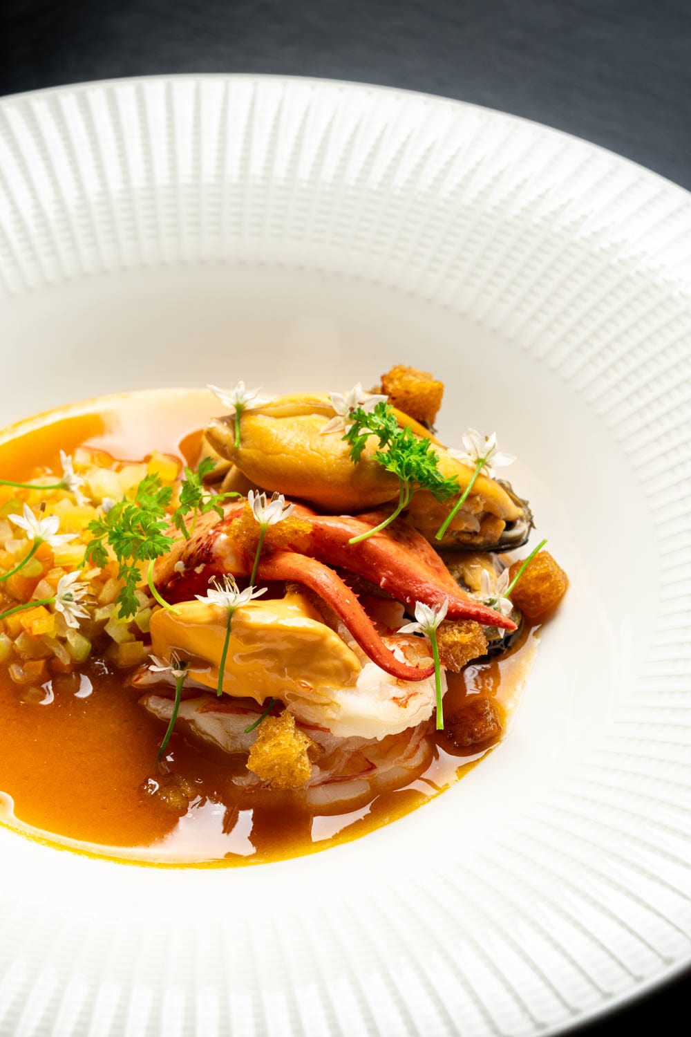 Seafood dish with lobster claw and mussels at Restaurant Lucie